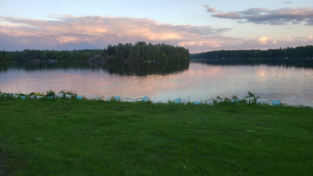 The French River reflecting the evening sunset,